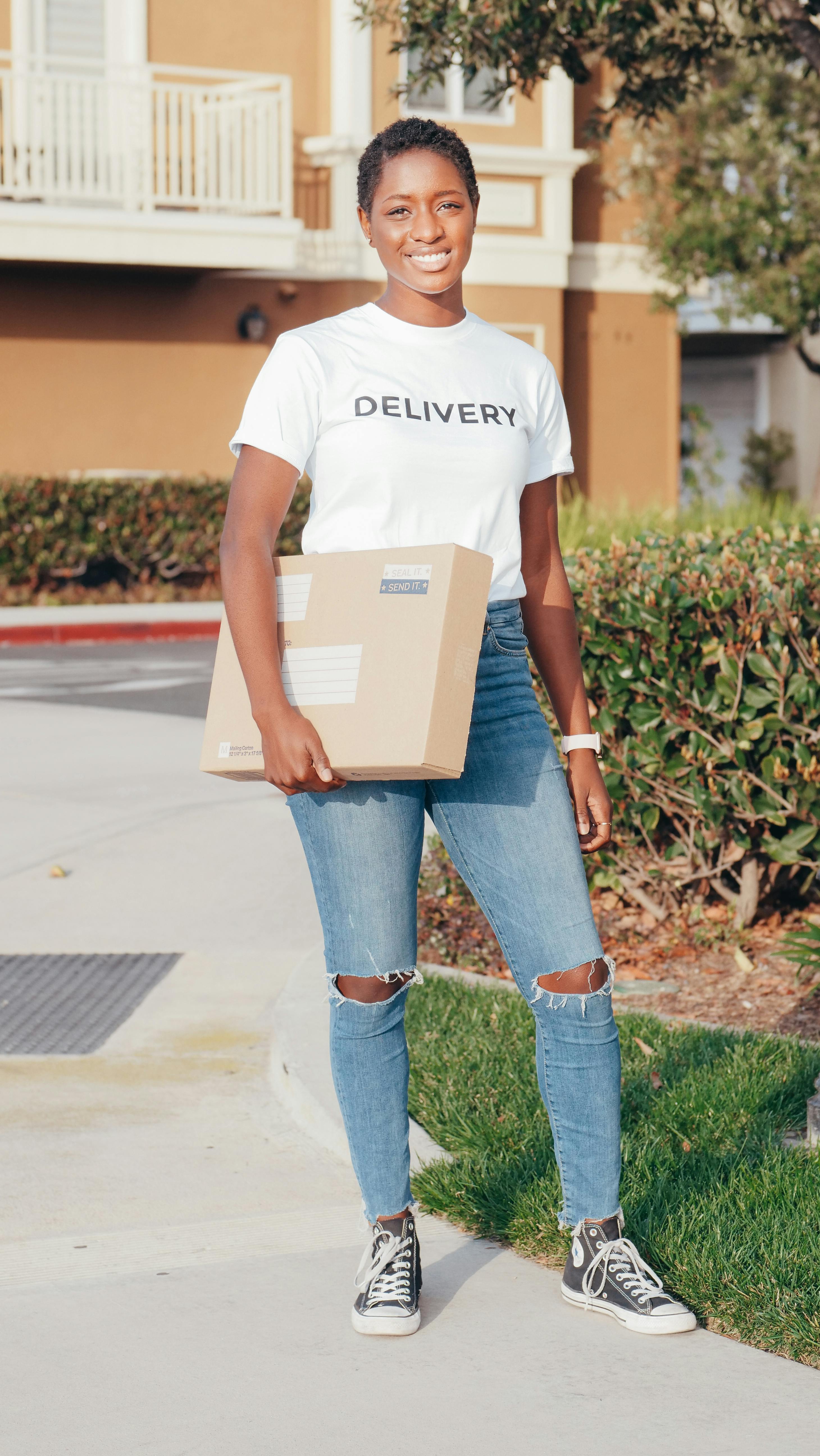 Delivery person with package showing fast turnaround