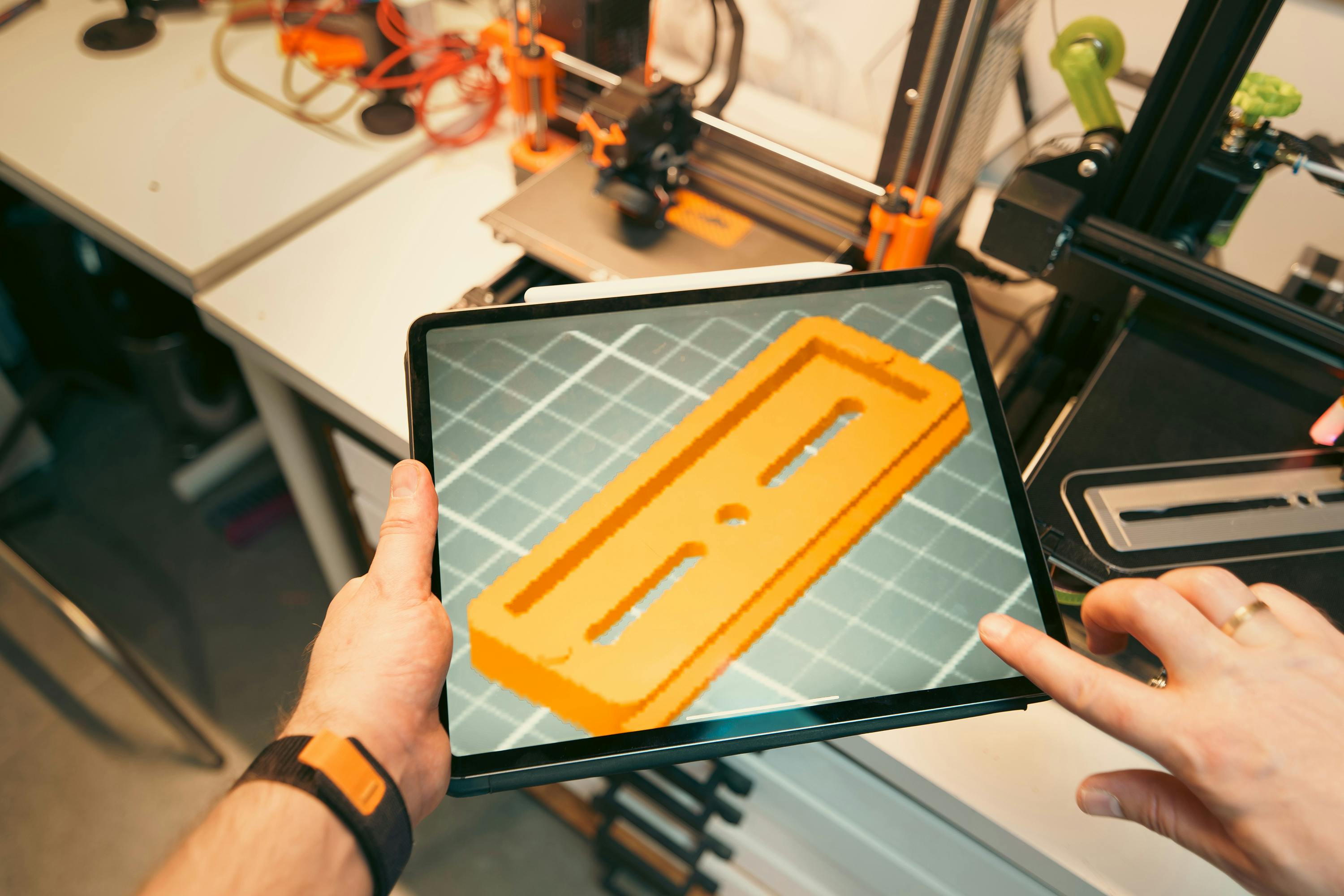 3D printer with tablet showing design support and consultation