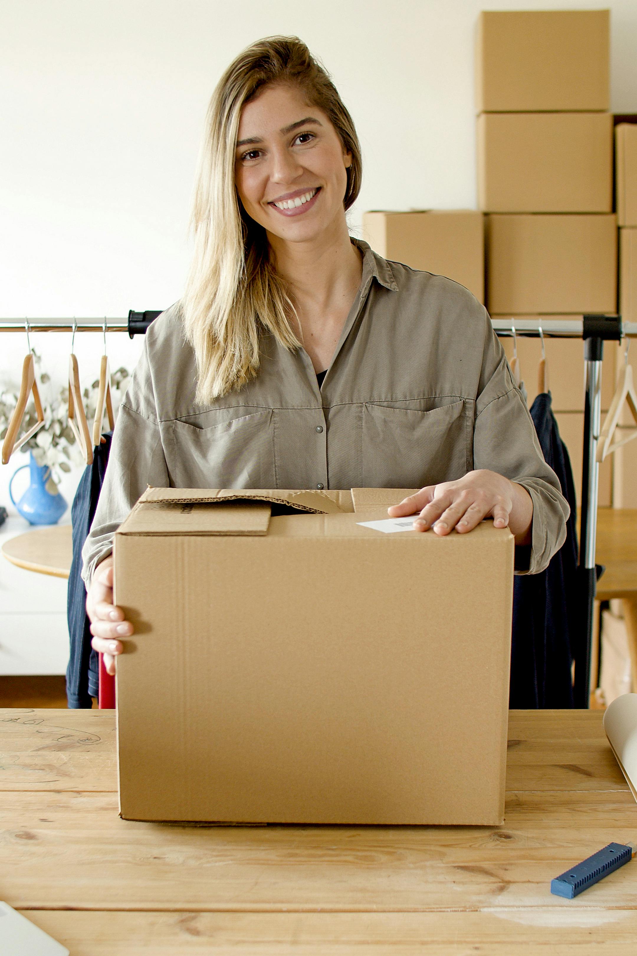 Woman packaging orders showing no minimum order requirement